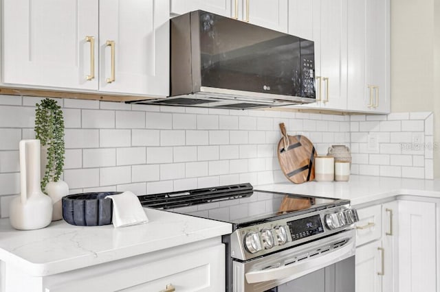 kitchen with white cabinets, stainless steel range with electric stovetop, light stone counters, and tasteful backsplash