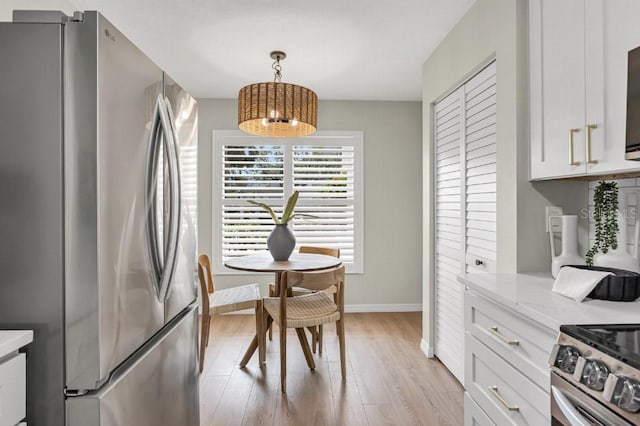 dining room featuring light wood-type flooring