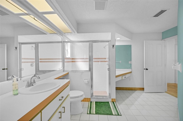 full bath featuring toilet, visible vents, a textured ceiling, and vanity