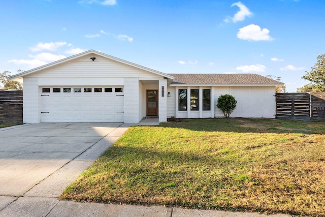 ranch-style home featuring a garage and a front yard