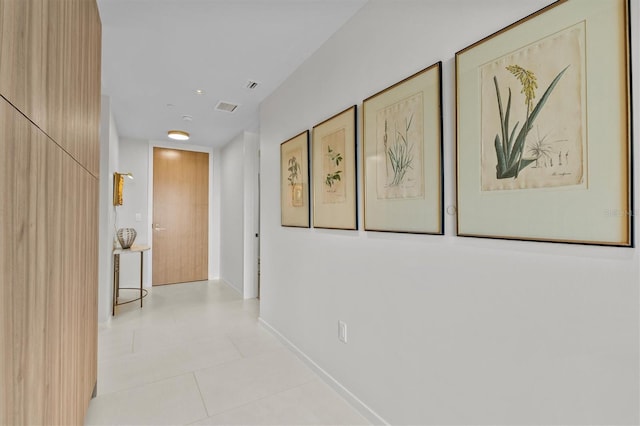 hallway featuring light tile patterned floors