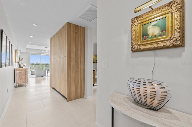 hallway with light tile patterned floors