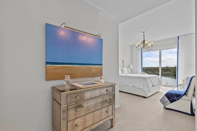 bedroom with light colored carpet and a chandelier