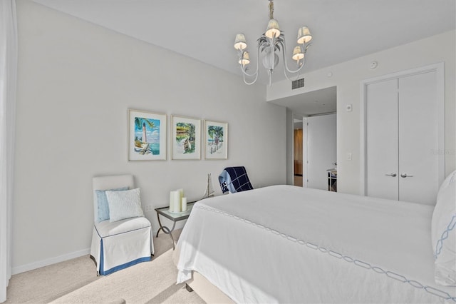 carpeted bedroom with a chandelier