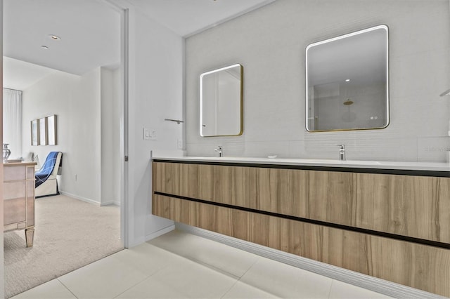 bathroom with tile patterned flooring and vanity