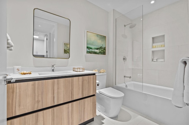 full bathroom featuring tiled shower / bath combo, vanity, and toilet