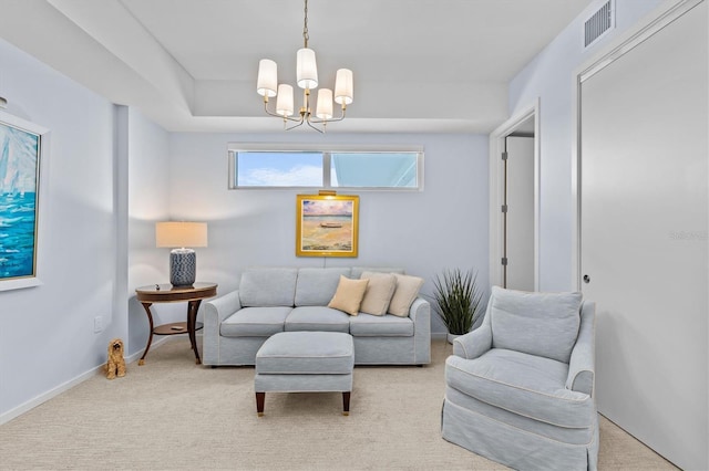 living room featuring light carpet and a notable chandelier