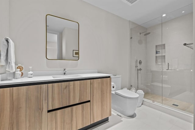 bathroom with vanity, toilet, tile patterned flooring, and a shower with door