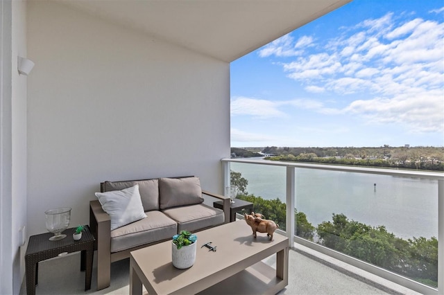 balcony with an outdoor hangout area and a water view