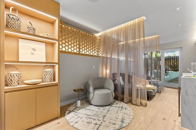 living area with light hardwood / wood-style floors