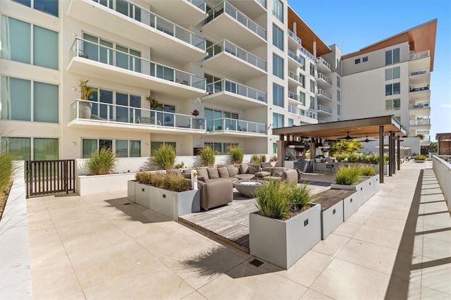 view of community with a gazebo, outdoor lounge area, and a patio