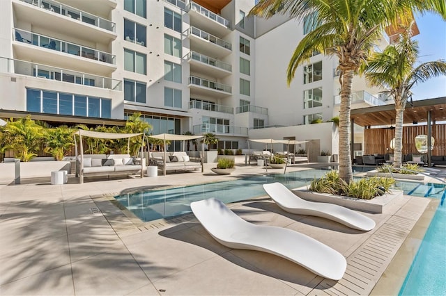 view of pool featuring an outdoor hangout area and a patio area