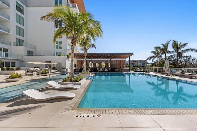 view of swimming pool with a patio