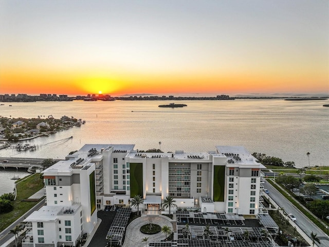 aerial view at dusk with a water view