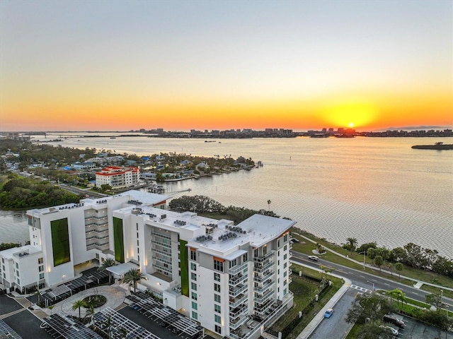 aerial view at dusk with a water view