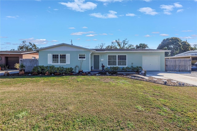 single story home featuring a garage and a front lawn