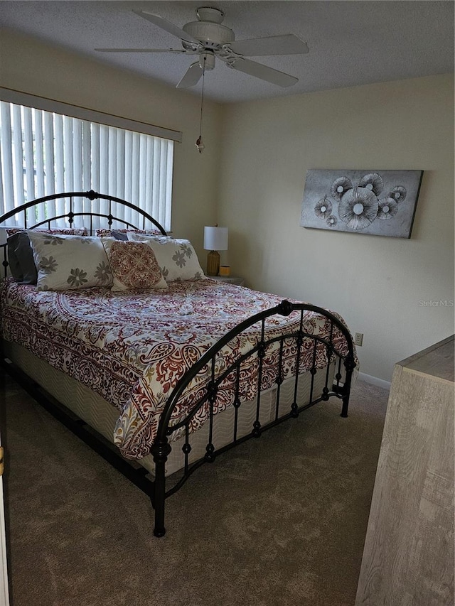 carpeted bedroom with multiple windows and ceiling fan