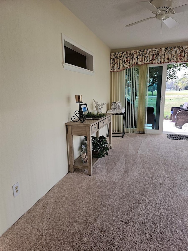 office area with light colored carpet and ceiling fan