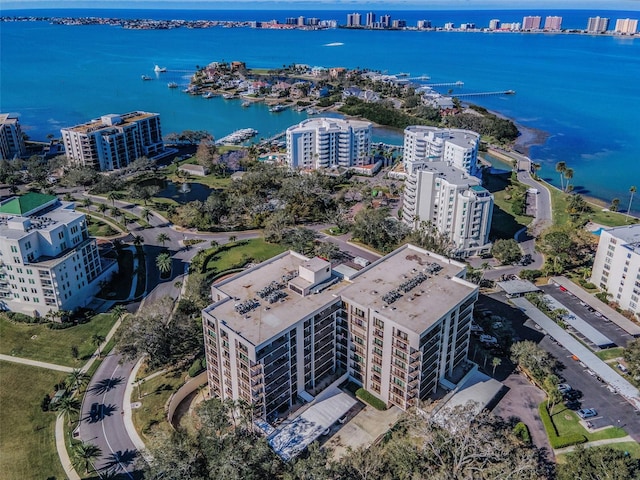 birds eye view of property with a view of city and a water view