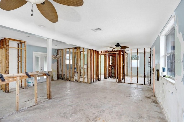 empty room with visible vents, a ceiling fan, and french doors