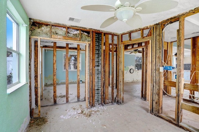 misc room with visible vents and a ceiling fan