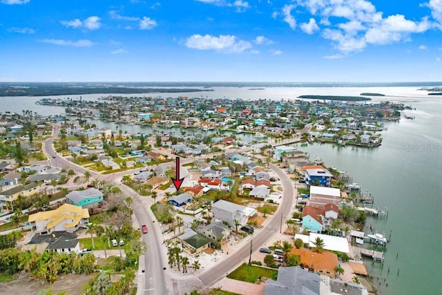 birds eye view of property featuring a residential view and a water view
