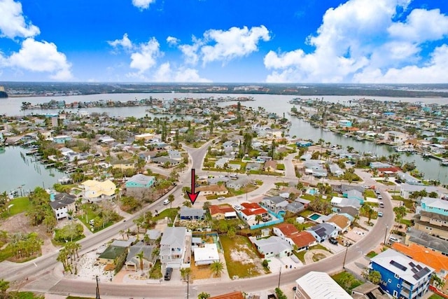 birds eye view of property with a water view and a residential view