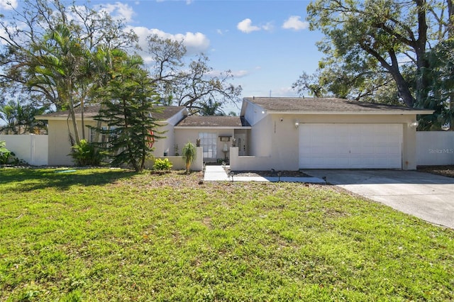 ranch-style house with stucco siding, concrete driveway, an attached garage, fence, and a front lawn