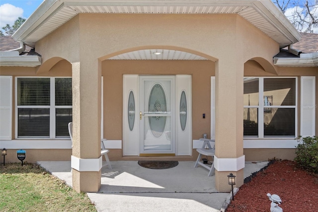 entrance to property with a patio