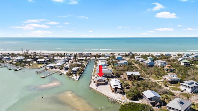 drone / aerial view featuring a water view and a residential view