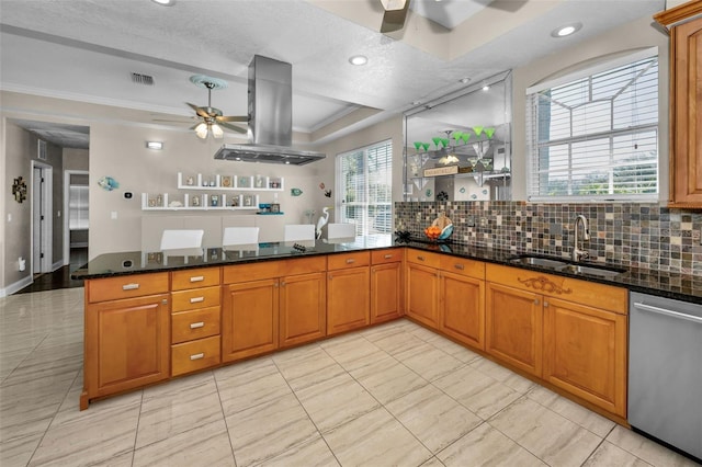 kitchen with dark stone countertops, island exhaust hood, a ceiling fan, and dishwasher