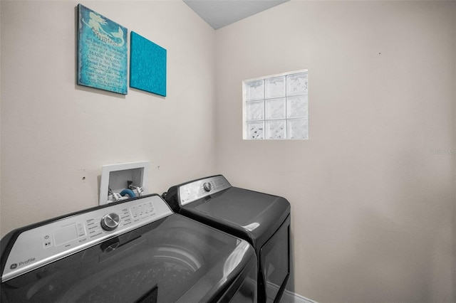 laundry room with laundry area and washing machine and clothes dryer