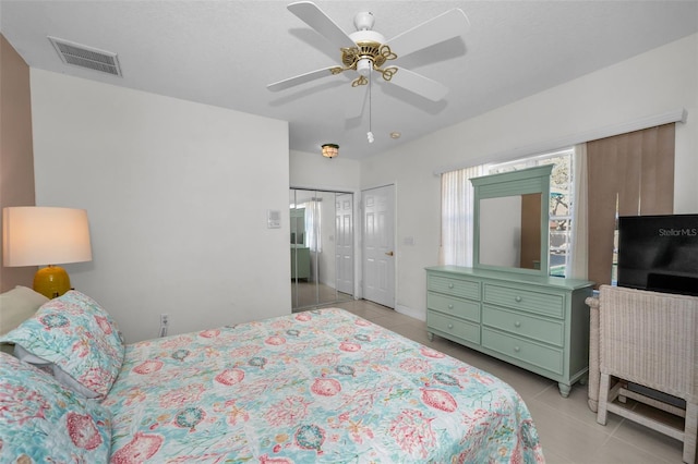 bedroom featuring light tile patterned floors, multiple windows, and visible vents