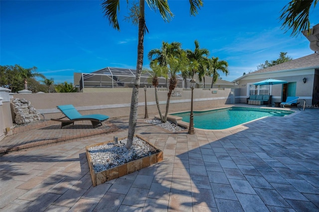 view of swimming pool featuring a patio area, a fenced backyard, and a fenced in pool