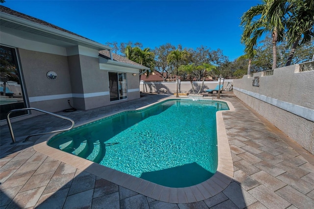 view of pool featuring a patio, a fenced backyard, and a fenced in pool