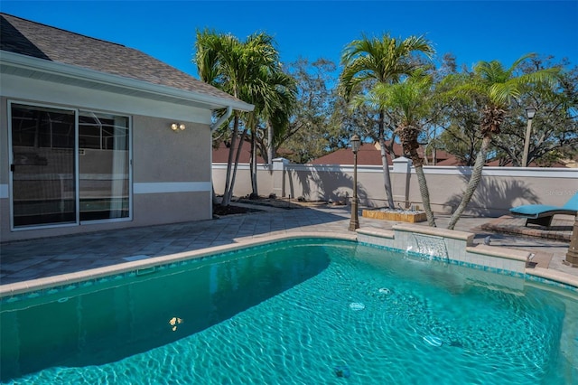 view of swimming pool with a patio area, a fenced backyard, and a fenced in pool