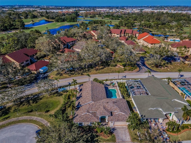 birds eye view of property featuring a water view and a residential view