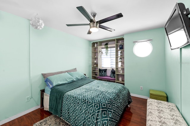 bedroom featuring dark wood-type flooring and ceiling fan