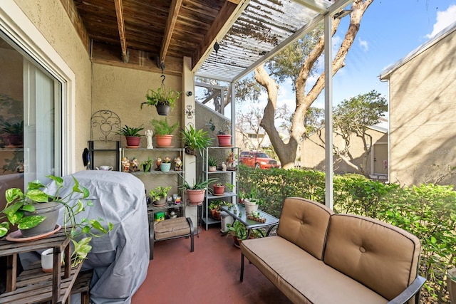 exterior space featuring a grill and a pergola