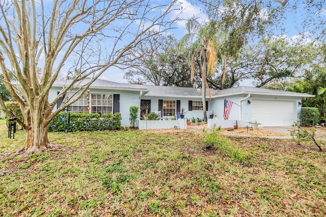 ranch-style home with an attached garage and stucco siding