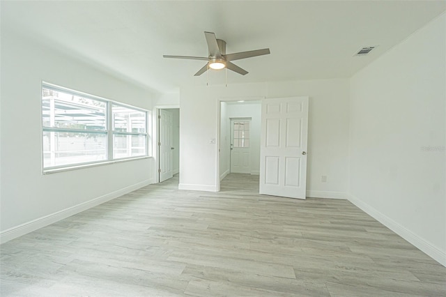 unfurnished bedroom with ceiling fan and light hardwood / wood-style floors