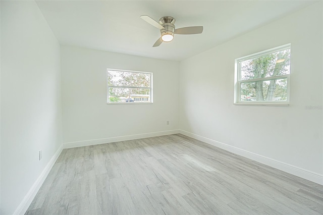 spare room with ceiling fan and light hardwood / wood-style floors