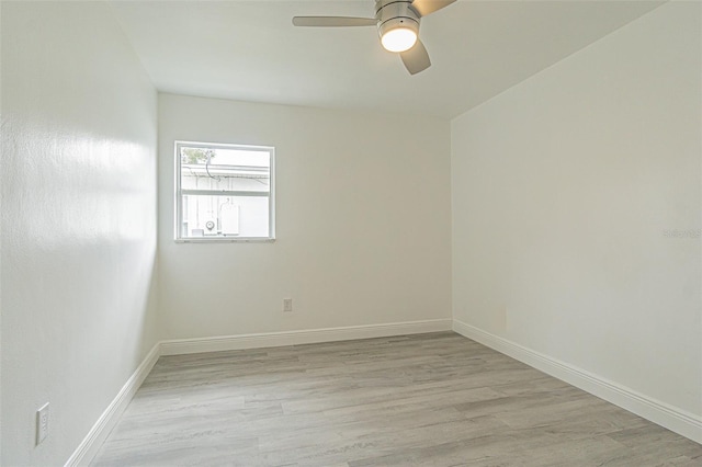 spare room with ceiling fan and light hardwood / wood-style flooring