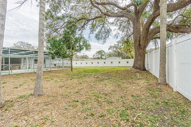 view of yard with a lanai