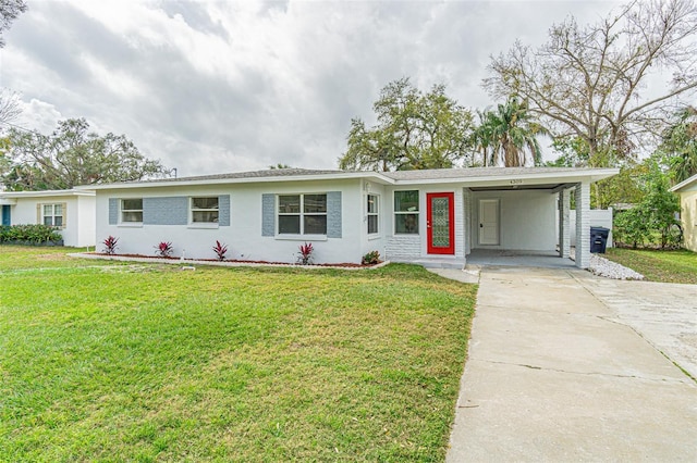 ranch-style home with a carport and a front yard