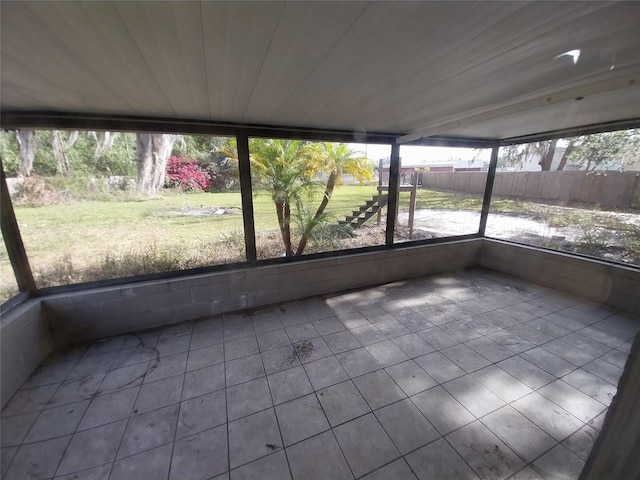 unfurnished sunroom featuring wooden ceiling