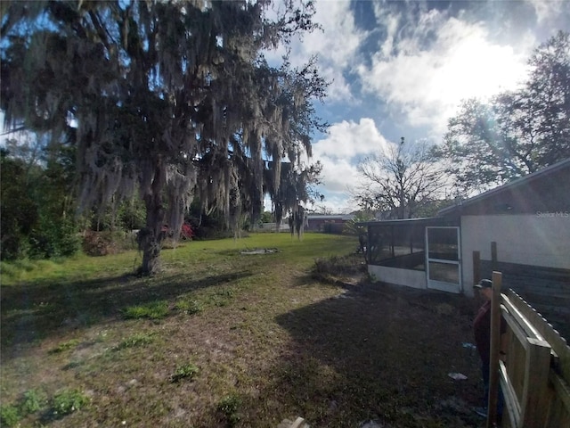 view of yard with a sunroom