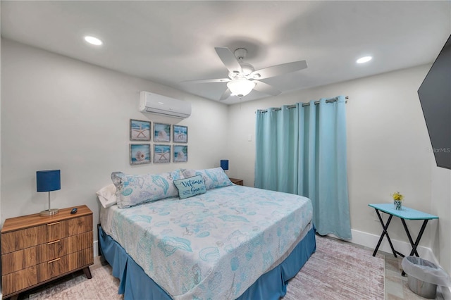 bedroom featuring an AC wall unit and ceiling fan