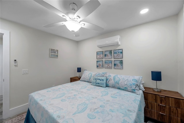 bedroom featuring ceiling fan and a wall mounted AC