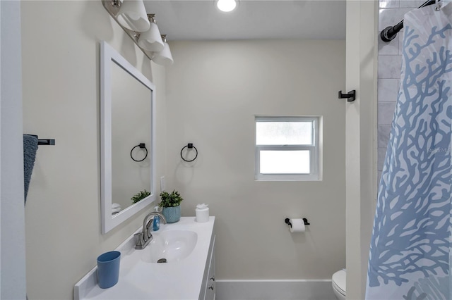 bathroom with vanity, toilet, and a shower with shower curtain